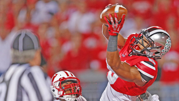Ohio State wide receiver Evan Spencer, right, catches a 25-yard touchdown pass against Wisconsin in the first half at Ohio Stadium in a game earlier this season. Spencer said the Buckeyes would “wipe the field” against Alabama and Florida State. (MCT Direct Photos)