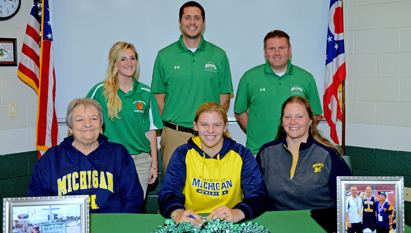 Fairland Lady Dragons’ 6-foot-4 senior center Terra Stapleton signed a national letter-of-intent Wednesday to play basketball at the University of Michigan. Attending the signing ceremony were: seated from left to right, grandmother Gloria Stapleton, Terra and mother Cathy Stapleton; standing from left to right, Fairland assistant coaches Katie Fuller and Adam Alt and head coach Jon Buchanan. (Kent Sanborn of Southern Ohio Sports Photos)