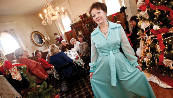 Floye Cooke models a light blue hostess dress during the Lawrence County Museum annual Christmas tea Saturday.