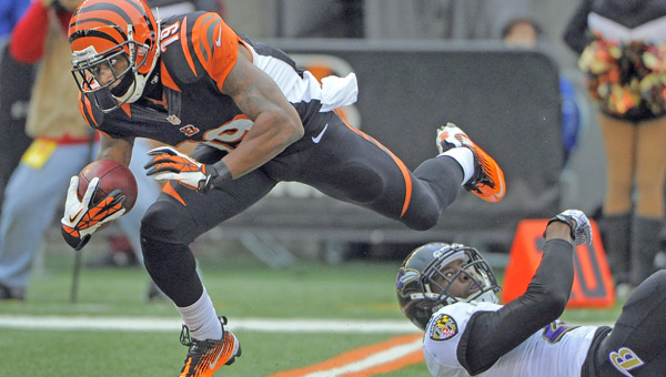 The Baltimore Ravens' Brynden Trawick, left, slows down Cincinnati Bengals punt returner Brandon Tate (19) at the 20 yard line in the second quarter at Paul Brown Stadium in Cincinnati Sunday. The Bengals defeated the Ravens, 34-17. (MCT Direct Photo)