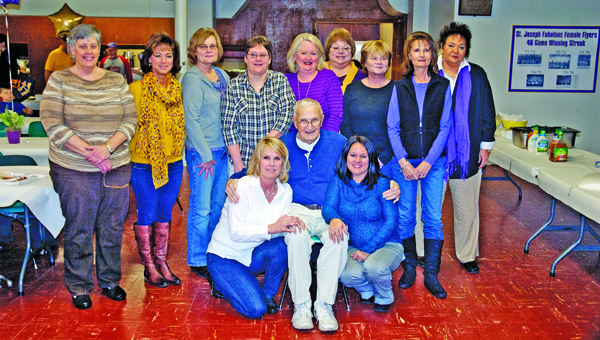 The St. Joseph Female Flyers basketball teams from the early 1970s who were among the first girls’ programs in the state of Ohio. The school hosted a reunion for those teams with several former players attending last Saturday. Pictured are: front row left to right, Sheila (Kline) Gagai, coach B.J. Hannon and mascot Jessie (Hanson) Basham; standing from left to right, Barb Lutz, Kathy (Roadcup) Crawford, Mary Ann (Holmes) Newhouser, Sherri Malone, Jane (Hacker) Laber, Mariclare (Bowen) Waginger, Barb Holmes, Andrea (Waginger) Harvey and Terri Hannon.