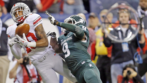 Ohio State wide receiver Philly Brown (10) can't make the catch against Michigan State safety Isaiah Lewis (9) during the first half in the Big Ten Championship game at Lucas Oil Stadium in Indianapolis on Saturday. The Buckeyes lost 34-24 and will now play Clemson Jan. 3 in the Orange Bowl. (MCT Direct Photo)