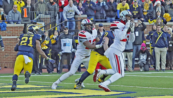 Ohio State Buckeyes defensive back Tyvis Powell (23) intercepts a two-point conversion against the Michigan Wolverines during the 4th quarter at Michigan Stadium in Ann Arbor, Mich., on Saturday. Ohio State won, 42-41. (MCT Direct Photo))