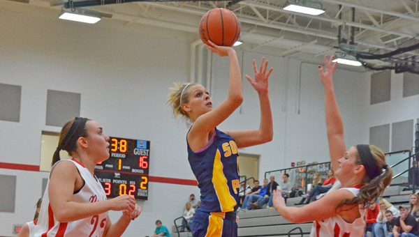 South Point Lady Pointers’ Brett Justice scores two of her 20 points in an Ohio Valley Conference win over the Rock Hill Redwomen on Thursday. (Robert S. Stevens of The Gold Studio in Ironton)