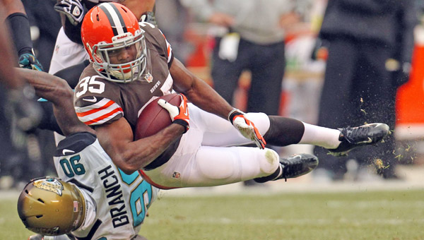 Cleveland running back Fozzy Whittaker, right, is upended by Jacksonville defensive end Andre Branch after a short gain at FirstEnergy Stadium on Sunday in Cleveland. The Jaguars defeated the Browns, 32-28. (MCT Direct Photo)