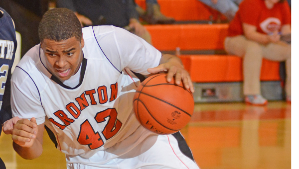 Ironton's Desmond Young (42) helped the Fighting Tigers battled taller Wesley Christian virtually even on the boards in a 73-53 win on Thursday. It was Ironton's first win of the season. (Kent Sanborn of Southern Ohio Sports Photos.com)
