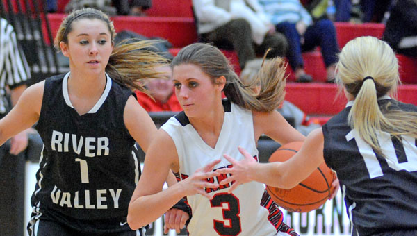 Coal Grove Lady Hornets’ Jacy Jones (3) drives through the River Valley defense for a layup,. Coal Grove beat the Lady Raiders 47-45 in overtime on Thursday. (Kent Sanborn of Southern Ohio Sports Photos)