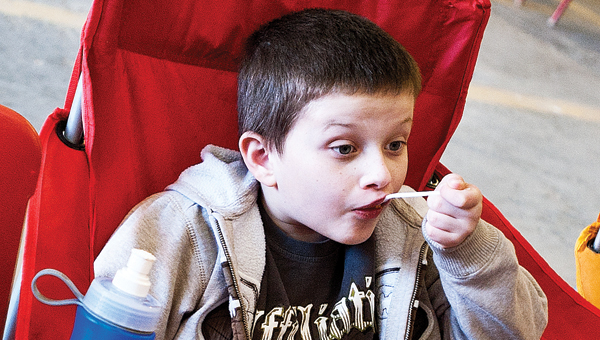 7-year-old Jonny Tibbs takes a bite of chili during the Upper Township Volunteer Fire Department Chili Cook-off Saturday at the fire station;
