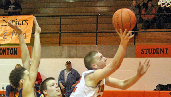 Ironton Fighting Tigers’ Tristan Cox knifes between two South Point defenders for a layup late in the game. The Pointers held off Ironton 42-38 on Friday. (Tim Gearhart of Tim’s News & Novelties in Ironton)