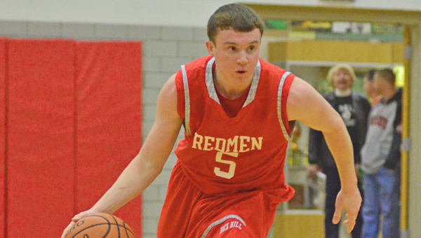 Rock Hill’s Aaron Dalton brings the ball up the court during Saturday’s game at Symmes Valley. Dalton hit seven 3-pointers and scored 23 points in a 54-45 win. Rock Hill, Symmes Valley and other area teams made their sectional tournament draws on Sunday. (Robert S. Stevens of The Gold Studio in Ironton)