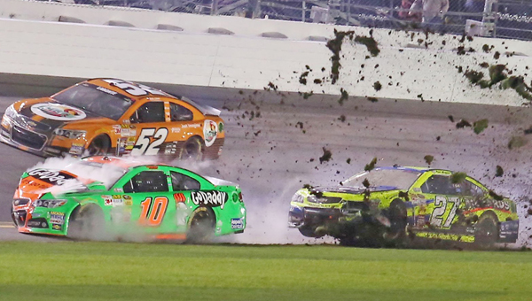 Way To GoDaddy: Danica Patrick (10) and Paul Menard (27) wreck during the Daytona 500 at Daytona International Speedway in Daytona Beach, Fla., on Sunday. (MCT Direct Photo)