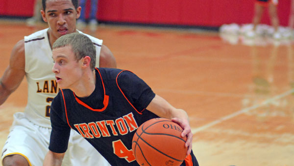 Ironton Fighting Tigers’ guard Phillip Kratzenberg (4) drives toward the basket as he looks to score against Federal Hocking. Ironton beat the Lancers 60-38 in the Division III sectional tournament semifinals Wednesday. (Kent Sanborn of Southern Ohio Sports Photos)