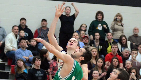 Coal Grove Hornets’ senior Conor Markins scores his 1,000th career points during Tuesday’s game. Fairland's Evan Maddox also reached the 1,000 career points total in the game. Coal Grove beat Fairland 76-69. (Kent Sanborn of Southern Ohio Sports Photos)