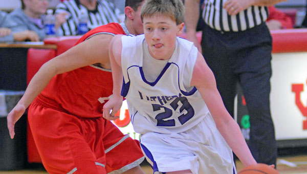 Chesapeake Panthers’ Gage Rhoades (23) drives hard up the court against the Rock Hill defense during Wednesday’s Division III sectional tournament semifinal game. Chesapeake won 44-31. (Kent Sanborn of Southern Ohio Sports Photos)