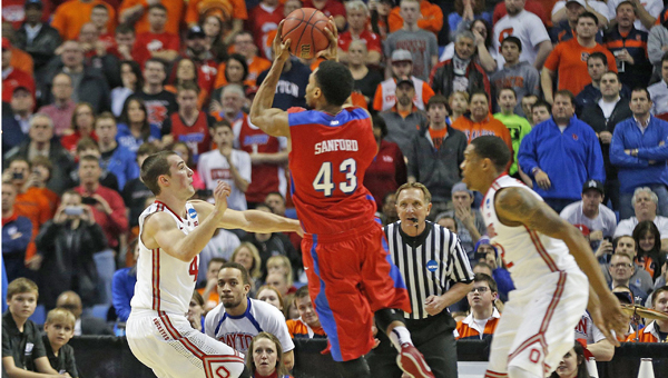 Dayton Flyers guard Vee Sanford (43) puts up the game-winning basket in the second half at the First Niagara Center in Buffalo, N.Y., on Thursday. The Dayton Flyers defeated the Ohio State Buckeyes, 60-59, during the second round of the NCAA Tournament. (MCT Direct Photo)