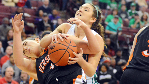 Fairland Lady Dragons’ Mackenzie Riley (right) goes over the shoulder of Versailles’ Emily Harman as they battle for a rebound during Friday’s Division III state basketball semifinal game at the Ohio State University Schottenstein Center. (Kent Sanborn of Southern Ohio Sports Photos)