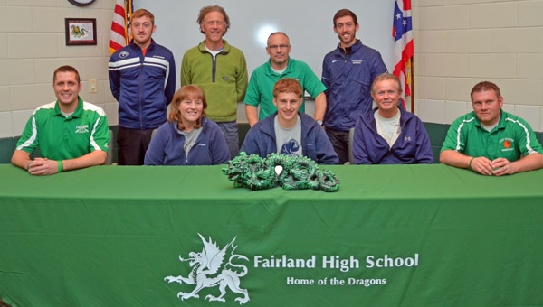 Fairland Dragons’ senior cross country and track runner Chad McComas signed a letter-of-intent Monday with Shawnee State University. Attending the signing were: seated from left to right, Fairland assistant coach Adam Alt, mother Deanna Thompson, Chad, father Randy Thompson and Fairland assistant coach Jon Buchanan; standing from left to right, SSU runner Ryan Stewart, SSU head coach Eric Putnam, Fairland head coach Chuck Wentz and SSU runner Joe Stewart. (Kent Sanborn of Southern Ohio Sports Photos)