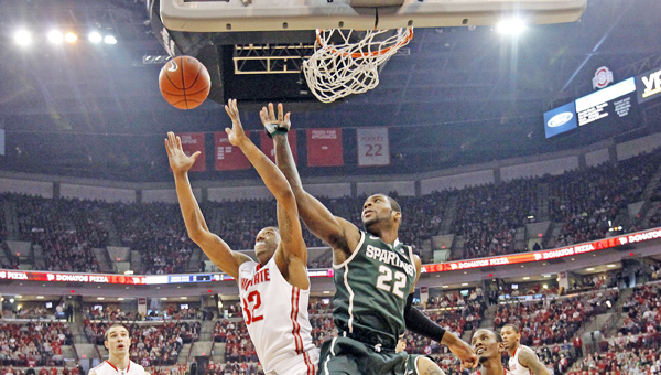 Ohio State Buckeyes guard Lenzelle Smith Jr. (32) and Michigan State Spartans guard/forward Branden Dawson (22) reach for a rebound during Sunday’s game at Ohio State. The Buckeyes beat Michigan State 69-67 and open Big Ten Tournament play Thursday afternoon as the No. 5 seed. Michigan State will be the No. 2 seed. (MCT Direct Photo)