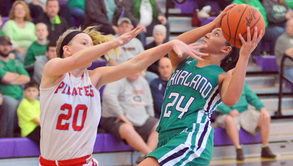 Fairland Lady Dragons’ Taylor Perry (24) drives for a layup during Saturday’s Division III regional finals. Fairland won 52-46 and plays Versailles at 3 p.m. Friday in the state semifinals at the Jerome Schottenstein Center on the campus of Ohio State University. (Kent Sanborn of Southern Ohio Sports Photos)