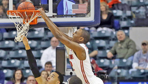 Ohio State’ Sam Thompson dunks over Purdue’s Kendall Stephens in the second half during the first round of the Big Ten Tournament at Banker’s Life Fieldhouse in Indianapolis on Thursday. Ohio State advanced, 63-61. (MCT Direct Photos)