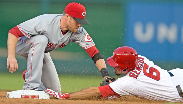 Washington Nationals third baseman Anthony Rendon (6) is tagged out at second base by Cincinnati Reds shortstop Zack Cozart (2) trying to stretch a hit into a double during the third inning of their game at Nationals Park in Washington, D.C, Monday. The Reds won 4-3 in 15 innings on Todd Frazier’s two-run home run. (MCT Direct)
