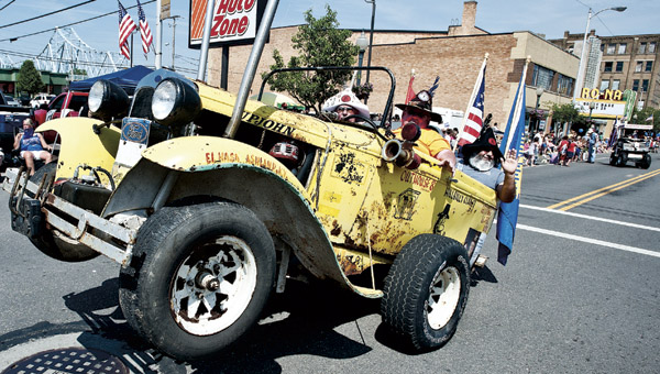 Members of the El Hasa Shriners show off their funny cars while taking part in the annual Memorial Day Parade in downtown Ironton.