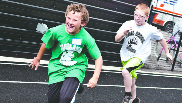 Donnie Nolan, a student at Fairland schools, becomes very excited as he passes his competitor during the boys 50-meter dash event at the Lawrence County Special Olympics event Tuesday in Chesapeake.