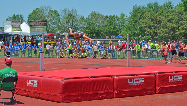 Coal Grove Hornets’ Brandon Adkins clears the high jump bar en route to winning the event and the Division III state championship on Friday at Jesse Owens Memorial Stadium. (The Ironton Tribune / Jimmy Walker)