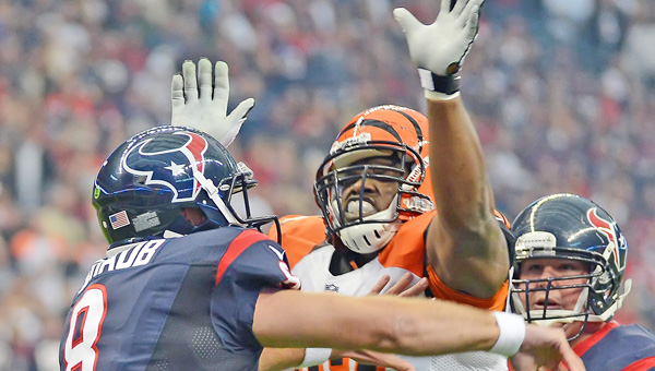 Geno Atkins (97) of the Cincinnati Bengals pressures Matt Schaub (8) of the Houston Texans. Atkins was placed on the physically unable to perform list Monday along with cornerback Leon Hall and seven other players. (MCT Direct Photo)
