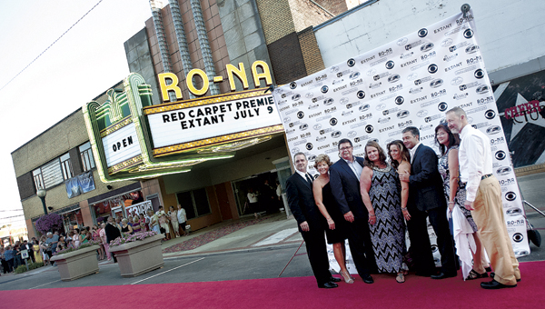 VIPs pose for pictures outside of the Ro-Na Theater before the premiere of Ironton native Mickey Fisher's show "Extant."