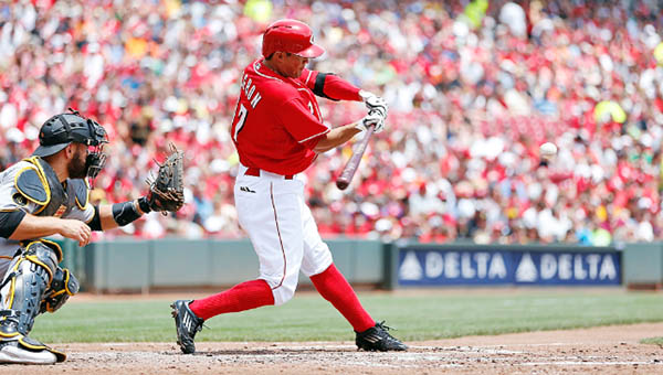 Cincinnati second baseman Kris Negron hit a three-run homer in the second inning — the first home run of his career — to help the Reds beat the Pittsburgh Pirates 6-3 and give Johnny Cueto his 10th win of the season on Sunday. (Courtesy of the Cincinnati Reds.com)