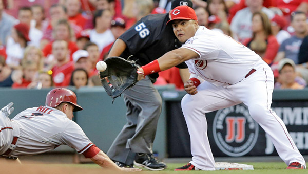 Cincinnati Reds' first baseman Brayan Pena takes a throw attempting to tag out an Arizona Diamondbacks' baserunner during Tuesday's game. The Reds won 3-0. (Courtesy of the Cincinnati Reds.com)