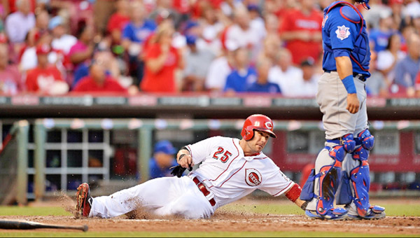 Skip Schumaker slides safely into home plate as he scores a run in the Cincinnati Reds 4-1 win over the Chicago Cubs on Wednesday. (Courtesy of the Cincinnati Reds.com)