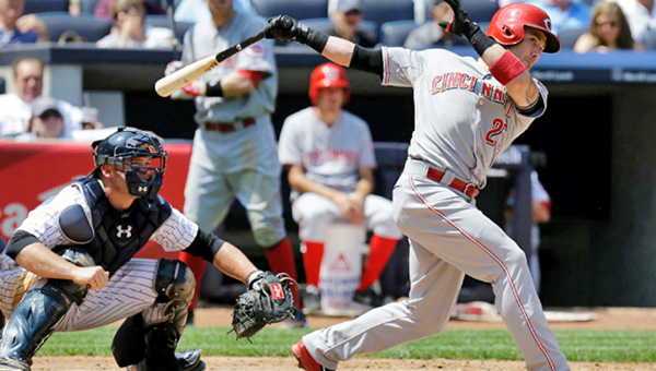 Cincinnati Reds’ second baseman Skip Schumaker — just off the disabled list — doubles home Zack Cozart in the fifth inning of Sunday’s game. Schumaker’s RBI wasn’t enough as the Reds lost to the New York Yankees 3-2. (Courtesy of The Cincinnati Reds.com)