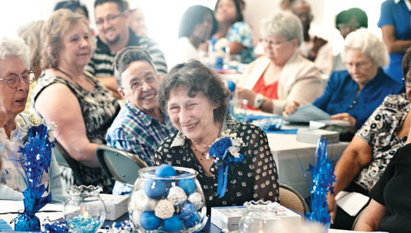 Jeane Shope, volunteer at the Lawrence County Open Door School, is recognized along with others for her 14 years of service during the COAD Foster Grandparents Senior Companion recognition.