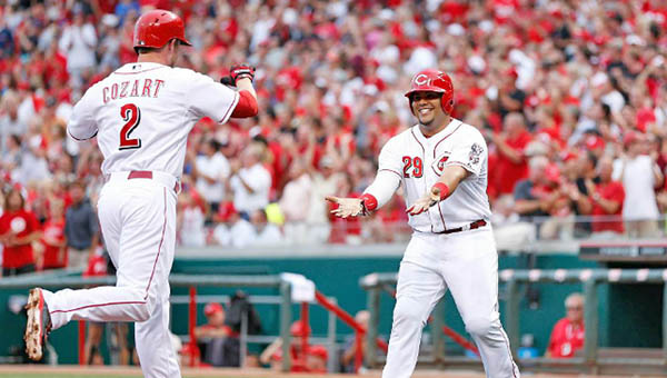Cincinnati shortstop Zack Cozart (2) is congratulated by Brayan Pena after he belted a three-run homer in the second inning to help the Reds beat the Cleveland Indians 8-3 Wednesday. (Courtesy of the Cincinnati Reds.com)