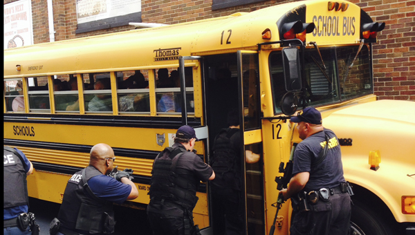 submitted Members of the Lawrence County Sheriff’s Office Special Weapons and Tactics (SWAT) team and the Ironton Police Department participate in a bus driver training scenarios with all county bus drivers. The purpose of the training was to make bus drivers aware of police actions during a possible hostage or active shooter situation on a school bus.