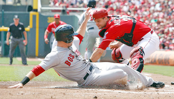 Cincinnati Reds' catcher Devin Mesoraco (right) can't get the tag down in time to get the sliding Mike Napoli who came home to score in the first inning Mike Napoli hit into a fielder's choice. (Photo courtesy of The Cincinnati Reds.com)
