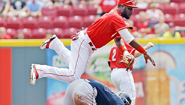 Cincinnati Reds’ second baseman Brandon Phillips gets the force out at second base despite a sliding Jason Heyward during the first inning of Sunday’s game. The Reds won 5-3. (MCT Direct Photos)