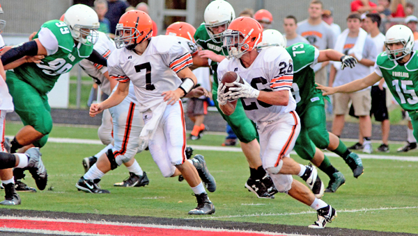 Ironton Fighting Tigers’ running back Tanner Price (26) follows the lead block of quarterback Jake Isaac (7) during last week’s scrimmage against Coal Grove. Ironton opens the season at Wheelersburg on Friday. (Kent Sanborn of Southern Ohio Sports Photos)