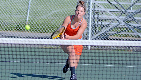 Ironton Lady Fighting Tigers’ senior Ariel Whitt uses a backhand swing to return a volley during a tennis match on Thursday. Jackson rallied in the final match to beat Ironton 3-2. (Kent Sanborn of Southern Ohio Sports Photos)