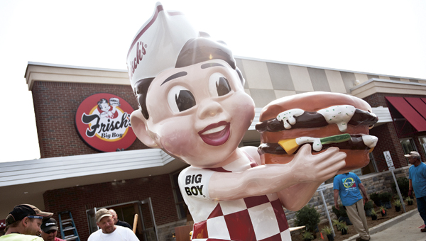 THE TRIBUNE/JESSICA ST JAMES The Frisch’s Big Boy statue after just being erected in front of the brand new restaurant in Ironton. Monday marks opening day.