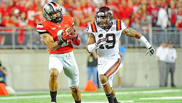 Ohio State Buckeyes’ wide receiver Devin Smith (9) makes a catch and run against Virginia Tech during last Saturday’s game. The Buckeyes were upset 35-21. (Andrew Weber/USA TODAY Sports)