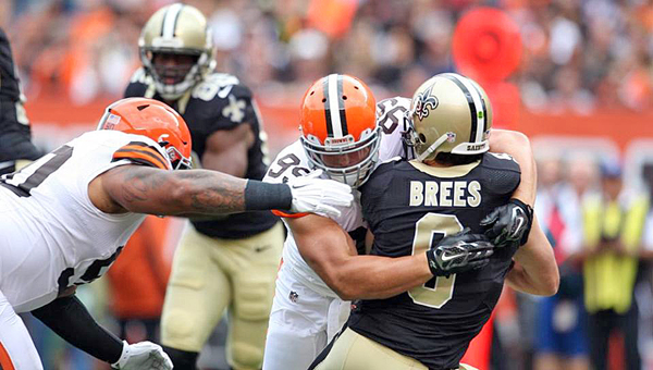 Cleveland Browns’ defensive lineman Paul Kruger (99) sacks New Orleans Saints’ quarterback Drew Brees during Sunday’s game in Cleveland. The Browns upset the Saints 26-24 on a last-second field goal by Billy Cundiff. (Courtesy of The Cleveland Browns.com)