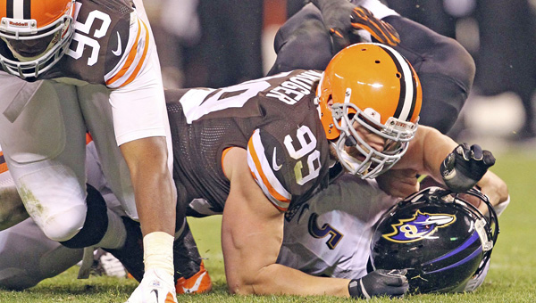 Cleveland Browns defensive lineman Paul Kruger (99) sacks Baltimore Ravens’ quarterback Joe Flacco in a game last season. Kruger — a former Raven — and the Browns host Baltimore on Sunday. (MCT DIrect Photo)