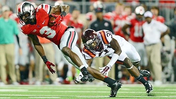 Ohio State Buckeyes’ wide receiver Michael Thomas (3) makes a catch and gets away from Virginia Tech Hokies’ cornerback Brandon Facyson (31) to score a touchdown during the third quarter at Ohio Stadium on Saturday night. The Hokies upset the No. 8 Buckeyes 35-21. (Andrew Weber – USA TODAY Sports)