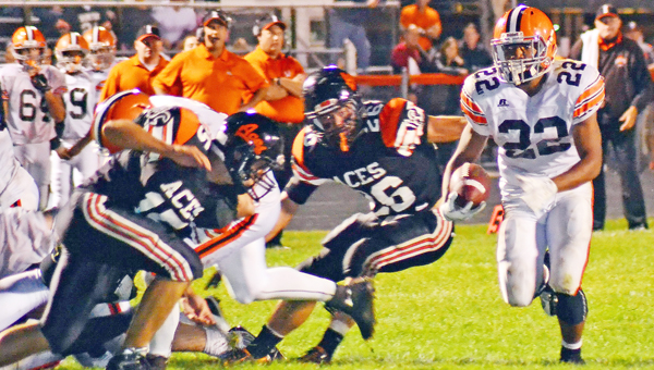 Ironton Fighting Tigers’ running back D’Angelo Palladino (22) looks to outrun Amanda-Clearcreek defenders during last week’s game. Palladino had 226 yards and four touchdowns in a 34-23 win. (Photo Courtesy of Circleville Herald)