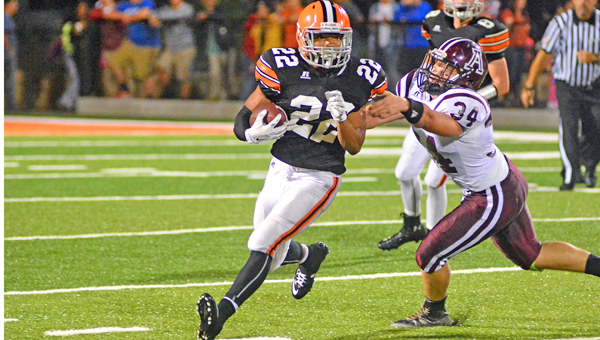 Ironton Fighting Tigers’ junior running back D’Angelo Palladino (22) runs past Ashland’s Cody Cline (34) as he gains some of his 270 yards in a 41-13 win on Friday. (Kent Sanborn of Southern Ohio Sports Photos)