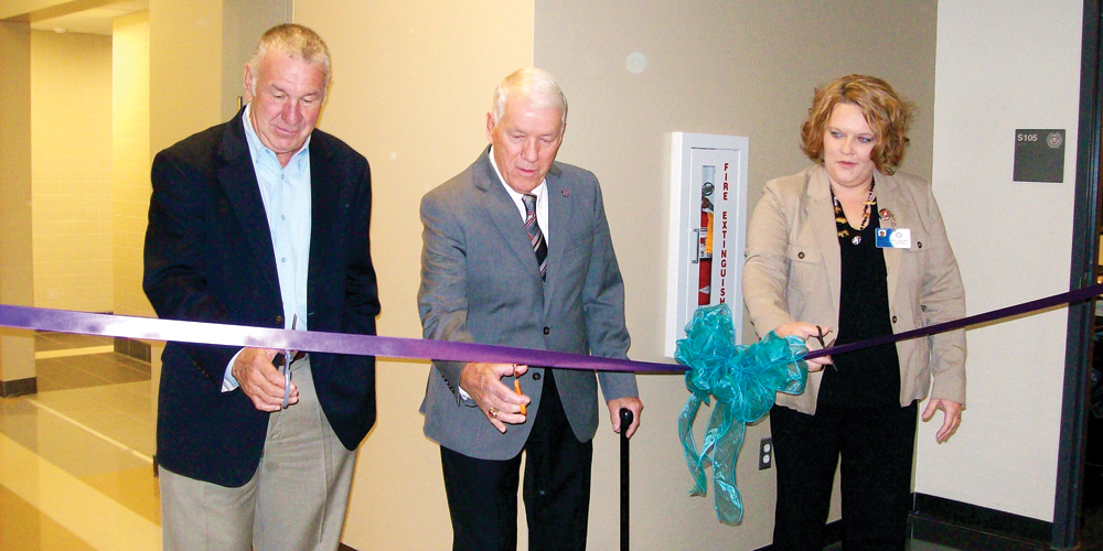 Superintendent Steve Dodgion along with school board president Carl Lilly and Jamie Chafin Director of Post Secondary Education at Collins Career Center cut the ribbon on the school’s new health center.