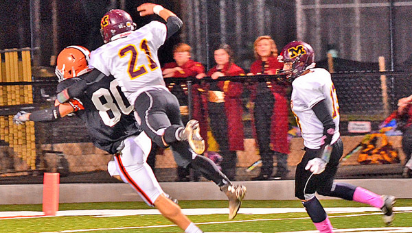 Ironton Fighting Tigers’ senior end Joe Bowling (80) makes the catch on a 51-yard pass play as he beats Meigs’ defensive back Michael Davis. Bowling’s catch went to the 5-yard line and set up an Ironton touchdown in a 41-18 rout on Friday. (Tony Shotsky of Southern Ohio Sports Photos)